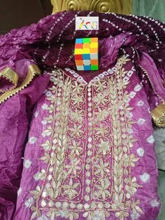 Thank you very much for visiting my shop. New Launched heavy suits pcs Bandhej silk suits with heavy hand goota Patti nd Kundan work with gotta bijjya border on duppta with same fabric silk bottom  Note: Duppta also with gotta Patti work 03 pcs suits Kurta 2.5 mitrs Duppta 2.5 mitrs Bottom 2.5 mitrs Easy to wear and very comfortable                                                    FREE STITCHING OFFER It Gracefully Add Style To Your Attire & Match With Your Confidence Disclaimer: Colors may sl Silk Traditional Wear With Dabka Work For Navratri, Purple Silk Kurta With Gota Work, Traditional Purple Kurta With Gota Work, Traditional Purple Sharara With Gota Work, Semi-stitched Raw Silk Set With Gota Work, Purple Gota Work Sets For Eid, Purple Raw Silk Dupatta With Gota Work, Purple Sets With Gota Work For Eid, Purple Art Silk Sharara With Dori Work