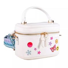 This Authentic Mini Travel Vanity Bag Is From Skinnydip London. It Has A White Background With A Y2k Themed Print That Feature A Combination Of Embroidered And Printed Stars, Flowers, Yin Yang, & Butterfly Along With The Words "Flower Power" . This Has A Detachable Strap Which Is Stored Inside The Zipped Compartment Of The Purse. This Is Probably The Cutest Makeup Travel Bag You Will Ever Own Or Collect! Perfect For Any Beauty Enthusiast Who Wants To Keep Her Travel Essentials On Her At All Time White Rectangular School Box Bag, Trendy Handheld Box Bag For School, Trendy White Large Capacity Box Bag, White Cute Satchel With Detachable Strap, Cute White Satchel With Adjustable Strap, Cute White Satchel With Detachable Strap, Trendy White Handheld Box Bag, Trendy White Box Bag For Gift, Trendy White Box Bag As Gift