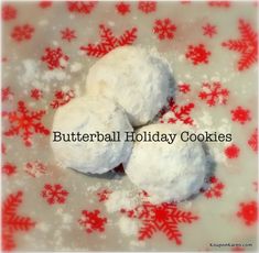 three snowball cookies sitting on top of a table