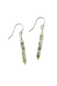 Add a touch of elegance to any outfit with the Root Green Garnet Gold Earrings. These dainty earrings feature solid natural stones with bright gold accents for a chic and refined look. Whether it's a casual day out or a special occasion, these earrings are the perfect accessory. Elegant Green Earrings With Natural Stones, Green Faceted Sterling Silver Earrings, Everyday Green Earrings With Natural Stones, Dainty Green Earrings For Everyday, Green Faceted Earrings For May Birthstone, Dainty Faceted Everyday Earrings, Garnet And Gold, Green Garnet, Bright Gold