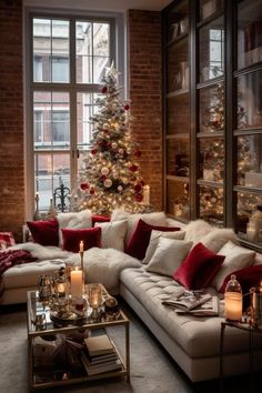 a living room filled with lots of furniture and a christmas tree in the window sill