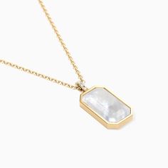 At the heart of this pendant, a vibrant emerald cut gemstone takes center stage. Nestled within a halo of high polished gold vermeil on our signature delicate link chain, the Tessa Tag necklace, serves as both the ultimate layering necklace or statement piece - perfect for adding depth and dimension to your ensemble. The vintage styled bail adds an extra touch of glamour to this already extraordinary pendant. Adorned with three sparkling CZ stones, it creates a dazzling contrast that elevates th Layering Necklace, Center Stage, Cz Stone, Tag Necklace, Emerald Cut, Link Chain, Layered Necklaces, Pearl White, Gold Vermeil