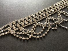 "Romantic choker necklace design just perfect to wear on your wedding day or any special event! We have also added an extra long cable chain finished at end for you to adjust the length. Color: silver with clear rhinestone crystals Size: choker measures around 15.75\" total long (including extra long cable chain) x 2.4\" center drop Item ship out with tracking number to you (around 10 to 14 business days for delivery). We also provide fast shipping service, around 3-4 business days delivery but Silver Party Necklace With Jewels, Silver Necklace With Jewels For Parties, Glamorous Gold Choker For Wedding, Glamorous Silver Necklace For Parties, Elegant Adjustable Choker For Evening, Elegant Evening Choker, Elegant Metal Choker For Wedding, Glamorous Wedding Choker Jewelry, Adjustable Sparkling Rhinestone Necklace For Wedding