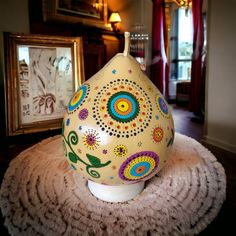 a decorative vase sitting on top of a rug