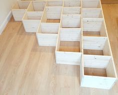 several wooden boxes are arranged on the floor