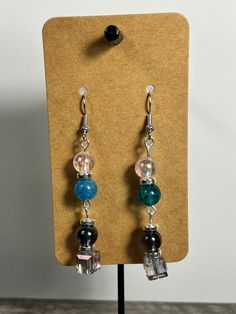 Handmade Earrings - Colors Series Each piece is meticulously handcrafted using craft wire, hypoallergenic earring hooks, and premium beads including crystal, glass, wood, ceramic, acrylic, resin, stone, and silicone beads. Care Instructions: Avoid moisture. Remove prior to bathing, showering, swimming, or exercising. Avoid allowing the item to fold when storing.  Shipping Information: Your items will be shipped within 1-2 business days once payment is received. Shipping within the US is via first class mail or you may choose to upgrade to Priority Mail for a small fee. Each item is carefully wrapped and packaged for safety during transit. Returns & Exchanges: As this is a wearable item, I do not accept returns or exchanges on this item. All sales are final. If there is a problem once your Bohemian Glass Beaded Drop Earrings, Bohemian Glass Beaded Earrings With Ear Wire, Bohemian Beaded Earrings With Glass Ear Wire, Unique Dangle Crystal Earrings With Ear Wire, Bohemian Glass Drop Earrings, Glass Beaded Dangle Earrings For Gift, Unique Crystal Earrings With Wire Back, Adjustable Unique Crystal Earrings With Ear Wire, Bohemian Resin Earrings With Ear Wire