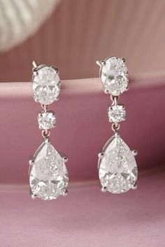 14kt white gold plated earrings embellished with oval, pear and round shaped lab diamonds. - Aza Fashions Jewellery Earrings, Diamond Drop Earrings, Gold Plated Earrings, White White, 14kt Gold, Lab Diamonds, Aza Fashion, Diamond Earrings, Pear