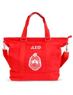 a red tote bag with the logo on it