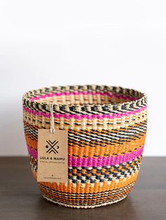 a woven basket with a tag on it