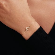 "1- P R O D U C T ∙  D E S C R I P T I O N Showcase your love with our Interlocking Heart Bracelet in 14K Solid Gold. Perfect as a couple bracelet or a stunning gift for her, this double heart bracelet captures the essence of romance. Crafted from 14k solid gold, it adds a touch of luxury to any outfit. This 14k gold jewelry is not just a purchase, but an investment in timeless style. 2- P R O D U C T ∙  D E T A I L S Gold material: 14K solid gold Choice of gold color: Yellow gold, Rose gold, White gold Choice of chain length: 5\", 5.5\", 6\", 6.5\", 7\" +1\" Extender Dimensions: * Height: 9 mm /  0.35 in * Width: 12 mm /  0.47 in 3- S H I P P I N G ∙ A N D ∙ R E T U R N S We know you're excited to get your hands on your order, and we're just as excited to get it in your hands. We take pri Delicate Bracelets For Valentine's Day, Personalized Diamond Bracelet As Gift, Elegant 14k Gold Bracelets For Valentine's Day, 14k Gold Diamond Bracelet For Valentine's Day Gift, White Gold Heart Diamond Bracelet For Valentine's Day, 14k White Gold Promise Bracelets, Heart-shaped White Gold Diamond Bracelet For Valentine's Day, Dainty Heart Bracelet For Valentine's Day, Delicate Yellow Gold Heart Bracelet For Anniversary