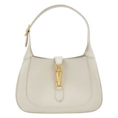 Gucci Jackie 1961 White Leather Bag with Adjustable Strap Size Small These are professional photos of the actual bag offered by Luxbags. The Gucci Jackie 1961 White Small bag is a modern take on an iconic design. Crafted in leather with a structured silhouette, it features a crossbody strap so you can bring your essentials wherever life takes you. Its baby blue hue is sure to add a touch of elegance to your wardrobe. CONDITION: VERY GOOD This preloved authentic bag is in very good condition with moderate signs of use throughout. Stains on the bottom and rubbing around the corners. DETAILS GUCCI Jackie 1961 White calfskin leather Beige suede lining Gold-tone hardware Piston lock Size Small Width: 27cm x Height: 18.5 x Depth 3.5cm ACCESSORY: Adjustable long shoulder strap White Jackie Bag, Gucci Jackie White, White Designer Gucci Bags, Gucci Jackie 1961 Bag, Gucci Jackie Hobo Bag Vintage, White Gucci Bag, Gucci Jackie 1961, White Leather Bag, Gucci Purse