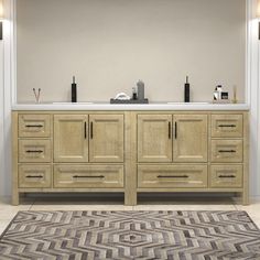 a bathroom vanity with two sinks and an area rug