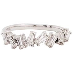 a white gold ring with three baguettes on the side and two diamonds in the middle