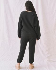 Inspired by a vintage athletic sweatpant, The Stadium Sweatpant. has an elasticated waist and legs with hidden drawstring. Pair back to tees and sweatshirts, or with a feminine blouse for an ironic look. 100% Cotton Machine Wash Cold Tumble Dry Low Made in the U.S.A. Relaxed Fit Sportswear Sweatpants For Fall, Sporty Tracksuit With Elastic Waistband For Fall, Relaxed Fit Sweatpants For Fall Sportswear, Black Sweatpants With Elastic Cuffs For Leisure, Black Sweatpants With Elastic Cuffs For Loungewear, Oversized Athleisure Joggers With Elastic Cuffs, Black Oversized Sporty Sweatpants, Relaxed Fit Tracksuit With Elastic Waistband, Oversized Black Sporty Sweatpants