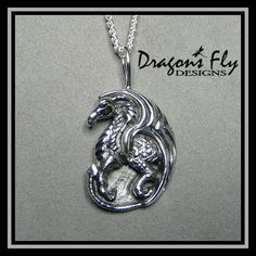 "Sterling Silver Dragon Pendant Dragon Necklace Dragon Jewelry The Dragon is 1 1/2\" tall by 1\" wide Hand carved into a thick Solid Sterling Silver pendant - Fully dimensional and Detailed Choose Antiqued Finish which highlights the details by darkening the recessed areas, or a solid bright finish, also known as Oxidized See our listings of Sterling Silver Chains and view the Oxidized Chains for a great match with the Antiqued Version. Sold on a satin adjustable necklace. Or, choose from a larg Dragon Blue, Necklace Dragon, Design Dragon, Silver Dragon Necklace, Blue Topaz Necklace, Dragon Necklace, Dragon Jewelry, Star Chain, Topaz Necklace