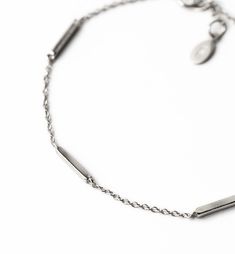 Dainty bars interspersed within the chain for the ultimate minimal look. Layer with other bracelets or wear alone for a delicate look. .925 Sterling Silver Hypoallergenic, lead and nickel free Adjustable Length: 6.25-7.25in (16-18.4cm) Handcrafted in NYC #B211 Minimal Bar, Bridal Bracelets, Bar Bracelet, Bridal Bracelet, Stackable Bracelets, Bar Bracelets, Bridal Accessories, Silver Bracelets, Handmade Bracelets