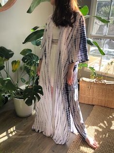 A beautiful handcrafted unisex kimono long robe dress by the hand tie-dye Removable waist tie closure Side slits at hem 100% Soft Rayon Hand wash in cold water, hang dry. Wear on the beach when on the vacation as well home Sizes: One size -One size fit all (Very oversized) Chest & Hip: 66 inches. Length: 54 inches. 🧍🏻‍♂️Tan: Model height is 188cm/6.2ft, (37-31-34") 🧍🏽‍♀️Ginger: Model height is 158cm/5.2ft, American small size (31-25-33") - Each piece is handmade, and due to the nature of Hippie Beach Cover-up Dress With Kimono Sleeves, Summer Beach Cover-up Kaftan With Kimono Sleeves, Free Size Bohemian Robe For The Beach, Bohemian Maxi Length Robe For Loungewear, Bohemian Wrap Dresses For Vacation, Flowy Maxi Dress With Kimono Sleeves For Summer, Long Summer Cover-up For Loungewear, Flowy Long Kaftan For Summer, Flowy Bohemian Robe For Vacation