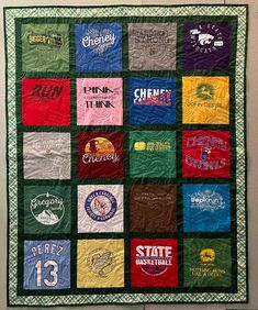 a quilt made to look like it has many different colors and logos on the front