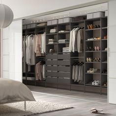 a bedroom with a bed, closet and shoes on the floor in front of it