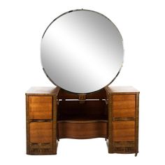 a mirror is on top of a dresser with two drawers and a drawer underneath it