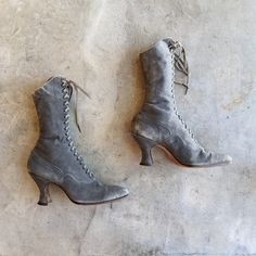 Stunning grey suede boots circa late 1910s to early 1920s with Louis heels.This hard to find color is a sweet dove grey, and the suede is incredibly soft.Made by Queen Quality Shoes in Boston Massachusetts, which was owned by Thomas Gustave PlantA very special pair of boots. Measurements Sizing on boots is always approximate, and I urge you to take careful measurements and ask any questions prior to purchasing.I believe these are an approximate size 5 US women's, but please check the following measurements.8. 75" inner sole length, but keep in mind the very pointed toe.2. 75" width measured across the bottom of the sole at the ball of the foot, and 8. 5" circumference at the same spot measured from the outside2. 75" heel11. 5" total height Condition Wonderful condition overall with some mi Gray Suede Boots, Witchy Style, Victorian Shoes, Grey Suede Boots, Witchy Fashion, Everyday Shoes, Find Color, Boston Massachusetts, Beautiful Boots