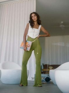 Green is the color of freshness and calm, so why not bring that serene emotion to your wardrobe? Whether you're looking for a casual street look or formal evening attire, these 70 stylish green pants outfit ideas are sure to please. So take a break from the mundane and explore all of the exciting possibilities this vibrant hue has to offer! Get inspired now! Green Pants Outfit, High Waisted Flare Pants, College Fits, Pants Green, Fleece Dress, Corsets And Bustiers, High Waisted Flares, Green Pants, Loungewear Sets