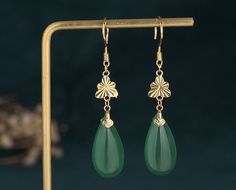 Handmade Genuine Green Jade Donut Earrings,18K Gold Plated Jade Earrings, Burmese Jade Earrings,Jade Dangle Earrings,Gift For Women Pendant Material: Hetian Jade The Hetian jade is the meaning of holding back peace and keep happiness. The natural Hetian jade can let your skin become smooth and good for your health. Notice: All the products are photographed under natural light, and what you see is the real thing. However, due to different monitors and other reasons, the color you see in the picture may be a little different compared with the real thing. Due to different measuring instruments. The product may have an error of 1-2 cm, please understand. Since we are purely handmade, there may be measurement errors in the measurement process. If you want an accurate size, please contact us or Donut Earrings, Boho Drop Earrings, Donuts Earrings, Burmese Jade, Hetian Jade, Long Tassel Earrings, Costume Earrings, Jade Earrings, Pretty Earrings