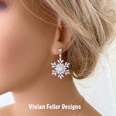 Snowflake Earrings Winter Wedding Bridal Jewelry Cubic Zirconia Sparkly Charming And Sparkle Like Diamonds! These Earrings Feature Tons Of Sparkling Clear Cubic Zirconia Stones Forming Together Given A Snowflake Like Design. Set In Beautiful Rhodium (White Gold) Finish Over Brass. They Sparkle Amazingly ! Perfect For A Winter Wedding Or Special Occasion ! Earrings Posts Are Sterling Silver. The Components Are High Quality Luster Rhodium Plated Over Brass - Tarnish Resistant, Lead Free, Nickel Fr Christmas Wedding Jewelry, Elegant Snowflake Shaped Cubic Zirconia Jewelry, Sparkling Silver Christmas Jewelry, Wedding Diamond Jewelry With Snowflake Design, Snowflake Cubic Zirconia Jewelry For Anniversary, Cubic Zirconia Snowflake Jewelry For Anniversary, Cubic Zirconia Jewelry For Christmas Anniversary, Christmas Anniversary Jewelry With Cubic Zirconia, Anniversary Snowflake Cubic Zirconia Jewelry