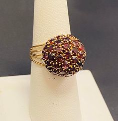 Beautiful 14k Gold ladies antique Gold garnet gemstone ring Size 7.5 (Re-Sizing is available if needed) Please see my shop with hundreds of other incredible pieces of unique jewelry! We are a 100 year old, 5th generation, family business called Colonial Coin & Jewelers in Cleveland Ohio.  Satisfaction guaranteed or return for full refund. Heirloom Style Round Garnet Cluster Ring, Heirloom Style Garnet Cluster Ring, Heirloom Garnet Cluster Ring, Vintage Multi-stone Ruby Ring In 14k Gold, Collectible Garnet Gemstone Ring, Antique 14k Gold Ruby Ring With Multi-stone, Vintage 14k Gold Multi-stone Ruby Ring, Vintage Garnet Cluster Ring With Gemstone, Vintage Multi-stone Ruby Ring Collectible