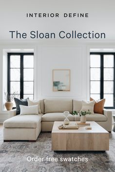 a living room filled with furniture and pillows on top of a wooden coffee table in front of two windows