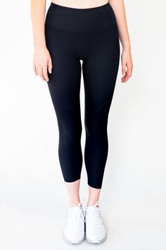 The Linear Legging in Black combines fashion and function, with a 4-way stretch ribbed fabric that is breathable, quick-drying, and moisture-wicking for a comfortable fit. The wide waistband provides tummy control and a flattering silhouette, while the triangle-shaped crotch allows for deep squats. The ribbed, non-slip design keeps the legging securely in place during any workout. Achieve both comfort and style in the Linear Legging.ra. Material: 69% Nylon & 31% Spandex GSM: 220G Model is 5'11" and wears a size M Gym Leggings With 4-way Stretch In Recycled Polyester, Moisture-wicking Compression Activewear With 5-inch Inseam, Sporty Full-length Tights With Wide Waistband, Casual Black Seamless Leggings, Sporty High-stretch Leggings With Wide Waistband, Sporty High Stretch Leggings With Wide Waistband, Sporty Stretch Activewear With 5-inch Inseam, High Stretch Mid-rise Elastane Leggings, Functional Mid-rise Yoga Pants With Elastic Waistband