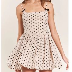 Get Ready To Turn Heads In The Nicolette Polka Dot Mini Dress! This Dress Features A Flattering Square Neckline And A Playful Bubble Hem. The Back Zip Closure Ensures A Secure Fit, While The Bow Detail On The Straps Adds A Charming Touch. With Adjustable Straps And All Over Polka Dot Detailing, This Dress Is Both Versatile And Stylish. Polka Dot Mini Sundress For Summer, Chic Polka Dot Mini Dress For Summer, Polka Dot Summer Mini Dress, Polka Dot Mini Sundress For Spring, Polka Dot Mini Dress For Summer, Polka Dot A-line Mini Dress For Summer, Polka Dot Mini Dress For The Beach, Chic Polka Dot Sundress For Summer, Spring Polka Dot Mini Dress