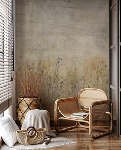 a room with two chairs and a basket on the floor next to a window covered in blinds