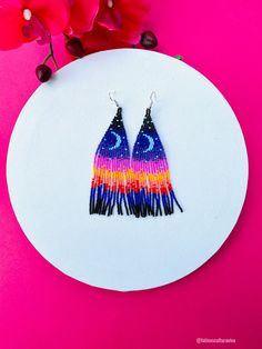 These beautiful beaded earrings are so colorful and perfect for all-day wear. They are definitely the perfect accessory to style up your look and add personality to your outfit. These lovely handmade earrings are made with sterling silver hooks and colorful beads. Each pair of earrings that we sell is authentic and one-of-a-kind! Finds more styles at https://www.etsy.com/shop/LatinxsCulturaViva?ref=simple-shop-header-name&listing_id=990207426&section_id=26730499 Thank you so much for vis Artsy Multicolor Round Bead Earrings, Artistic Colorful Beaded Earrings As Gift, Artistic Colorful Beaded Earrings For Gifts, Artistic Earrings With Colorful Beads As Gift, Artistic Earrings With Colorful Beads For Gift, Artistic Dangle Earrings With Colorful Beads, Artistic Multicolor Round Bead Earrings, Whimsical Multicolor Festival Earrings, Multicolor Whimsical Earrings