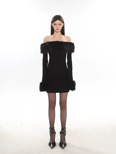 Embrace elegance with a twist in this off-shoulder faux fur trim mini dress, a chic addition to any wardrobe. 

Crafted with attention to detail, this dress features a sleek silhouette, long sleeves, and a playful faux fur trim that graces the shoulders, adding a touch of glamour. The fabric composition prioritizes comfort and style, ensuring a flattering fit for those evenings out or special events. 

Style this versatile piece with booties or heels for an evening look, or dress it down with a Social Gathering, Fur Trim, Mini Black Dress, Timeless Design, Fashion Forward, Faux Fur, Off Shoulder, Twist, Long Sleeves