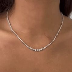 The Riviera Diamond Tennis Necklace is an exquisite piece of jewelry that combines elegance and timeless beauty. This necklace features a total carat weight of 4.00 ct., showcasing a dazzling array of diamonds. The diamonds used in this necklace range in size from 2.60 mm to 4.60 mm, creating a captivating visual effect with their varying sizes. The necklace is crafted with meticulous attention to detail and is set in a Buttercup Setting, which is known for its graceful and secure design. The Bu Diamond Tennis Necklace, 14k Yellow Gold Necklace, White Gold Necklaces, Tennis Necklace, Gold Jewellery Design, Jewelry Inspo, Dream Jewelry, Simple Necklace, Jewelry Lover