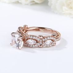 She is the type of person that makes forever seems too short. Treat beloved her to this stunning ring that celebrates your endless love and passion. This design features a shimmering round cut stone at the center, while marquise cut stones and additional round stones decorate the twisting shank. With rose gold color and milgrain on the shank,this ring shows a really elegant and exquisite on her finger. Carat Weight: 2.5 ctStone Size: 7 mmStone Type: Jeulia® StoneNumber of Stones: 1 Stone Color: Diamond WhiteStone Shape: RoundCarat Weight: 0.933 ctStone Size: 1.1,1.5,2,3*1.5 mmStone Type: Jeulia® StoneNumber of Stones: 63 Stone Color: Diamond WhiteStone Shape: Round, MarquiseWeight: 5.1 gWidth: 6.44 mmHeight: 8.32 mmThickness: 2.46 mmMaterial: 925 SilverPlating Color: Rose Gold Cubic Zirconia Halo Ring With Marquise Cut For Wedding, Elegant Marquise Diamond Promise Ring, Marquise Cut Bridal Set With Prong Setting For Promise, Marquise Cut Bridal Sets For Promise Ring, Marquise Cut Moissanite Halo Ring For Anniversary, Elegant Moissanite Stackable Rings For Anniversary, Elegant Marquise Cut Bridal Sets For Promise, Elegant Marquise Cut Wedding Rings, Anniversary Moissanite Halo Ring Marquise Cut