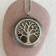 "The tree of life symbolizes life and the interconnections of the universe to sustain life. Timeless and classic, this gorgeous antiqued silver locket will become a special addition to your jewelry collection. This locket is extra large at 46mm in diameter, silver plated brass and opens for a secret place to keep pictures, messages, or whatever you like. The interior of the locket where a photo fits is 30mm. It can fit two photos. This locket is embossed on both sides and is lightweight and comf Etched Pendant Locket Necklace As A Gift, Spiritual Silver Locket Necklace For Memorial, Spiritual Stainless Steel Locket Jewelry, Symbolic Silver Tree Of Life Jewelry, Symbolic Silver Jewelry With Tree Of Life, Symbolic Tree Of Life Round Pendant Jewelry, Bohemian Silver Jewelry With Tree Of Life, Spiritual Locket Necklace For Keepsake, Spiritual Pendant Locket Necklace For Memorial