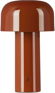 an orange table lamp with a white stripe on the bottom and a brown light at the top