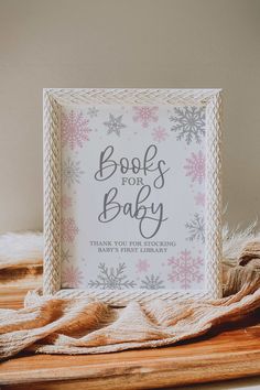 a baby's first birthday card with snowflakes on it and the words book for