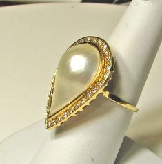 Excellent condition. Tests 14K. Top measures approx. 1 1/4 x 7/8 inch. Ring weighs 8.6 grams. Size 7 and easily sizable. Elegant Cabochon Rings For Collectors, Heirloom Pear-shaped Jewelry For Formal Occasions, Elegant Cabochon Teardrop Ring, Elegant Teardrop Cabochon Ring, Elegant Yellow Gold Pear-shaped Ring, Elegant Pear-shaped Yellow Gold Rings, Elegant Yellow Gold Pear Shaped Rings, Elegant Pear-shaped Formal Rings, Heirloom Teardrop Ring For Formal Occasions