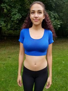 "This short sleeve form-fitting blue crop top is made from a stretchy cotton spandex fabric.   Worn With: Our Black Ultra Low Rise Capri Leggings. The model is 5'5\" and wearing a size small.  Size Chart (inches):                              S            M           L Bust                  26-30   30-34     34-36 Natural Waist  23           24            26 Length                12             13     14  Materials:  95% cotton, 5% spandex. Custom print on this crop top: Yes. You can request your own design on this crop top. There is a $16 custom design fee added to the price of the top. Local Pickup Available: Yes.  If you live in the south bay area in San Diego, you can pick up your crop top and receive up to 20%off.  Payment will be due on pickup. Country of Manufacture: Made in Califor Basic Cropped Workout Crop Top, Cotton Short Sleeve Sports Crop Top, Sports Cotton Crop Top With Short Sleeves, Basic Sports Crop Top, Cotton Short Sleeve Crop Top For Sports, Cotton Sports Crop Top With Short Sleeves, Blue Fitted Workout T-shirt, Blue Crew Neck Crop Top For Sports, Cotton Crop Top For Sports With Short Sleeves