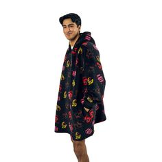 Dive into the world of Five Nights at Freddy’s with this black hooded blanket, featuring an all-over print of neon character heads from the iconic animatronics. Crafted from cozy coral faux shearling back plush, it includes onseam pockets for added convenience. Measuring 36” in body length with a 35” bottom opening width, this blanket ensures both comfort and style. It’s easy to care for. Just machine wash it on cold with like colors and tumble dry on low heat. Neon Character, Hello Kitty Characters, Freddy Fazbear, Hoodie Blanket, Wearable Blanket, Hooded Blanket, Pullover Jacket, Five Night, Five Nights At Freddy's