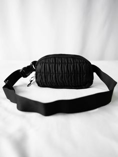 Belt bag dimensions: 8"L x 1.75"W x 5"H 100% Polyester Versatile style that allows you to wear it different ways Adjustable strap with plastic clasp Zipper closure for main compartment One zippered exterior side pocket Inside mesh pocket Trendy Black Nylon Bag, Black Belt Bag With Zipper Pocket For School, Versatile Black Belt Bag For School, School Belt Bag With Adjustable Strap, Black Chest Bag With Detachable Strap For Travel, Black Chest Bag With Detachable Strap For Daily Use, Black School Belt Bag With Zipper Pocket, School Pouch Belt Bag With Adjustable Strap, Black Travel Chest Bag With Detachable Strap