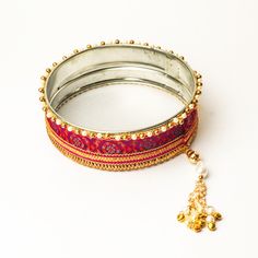 A specially curated Chalni for the auspicious celebration of Karwa Chauth, this Chalni is handmade with pure rawsilk fabric with golden & pearl colored beads that look absolutely elegant. Standard Chalni - 6.5 inches in diameter Gift this Pooja thali along with chalni for your wife who would be keeping a fast for you on the festive occasion of Karwa Chauth Gold Raw Silk Traditional Wear For Navratri, Wedding Dupatta In Brocade With Tilla Detail, Elegant Gold Dupatta With Tilla Detail, Gold Traditional Drape For Festive Occasions, Festive Gold Traditional Drape Wear, Gold Traditional Wear With Tilla Embroidery, Gold Traditional Wear With Gota Work For Wedding, Eid Dupatta With Latkans For Traditional Ceremonies, Eid Traditional Ceremonies Dupatta With Latkans