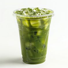 a plastic cup filled with green liquid and ice