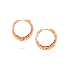 Add a touch of understated elegance to your style with Gilda's Goldens Hoops. These minimalist 14K gold earrings are the perfect accessory for casual and formal occasions. The simple hoop design provides a timeless, versatile, and sophisticated look. Ideal for those who appreciate simplicity and versatility, these earrings are sure to become a staple in your jewelry collection. Classic Rose Gold Huggie Earrings For Formal Occasions, Classic 14k Rose Gold Huggie Earrings, Classic Rose Gold 14k Huggie Earrings, Modern Small Hoop Huggie Earrings In Rose Gold, Classic Small Hoop Rose Gold Huggie Earrings, Classic Hypoallergenic Rose Gold Huggie Earrings, Classic Rose Gold Hypoallergenic Huggie Earrings, Classic Rose Gold Huggie Hoop Earrings, Classic Rose Gold Small Hoop Huggie Earrings