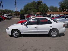 a white car parked in a parking lot