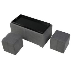 three square stools, one with a black top and the other in grey fabric