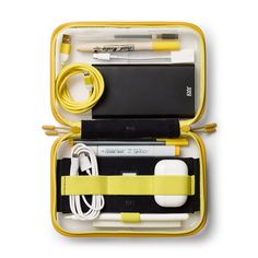 an open yellow case with various items in it, including pens and pencils on the inside